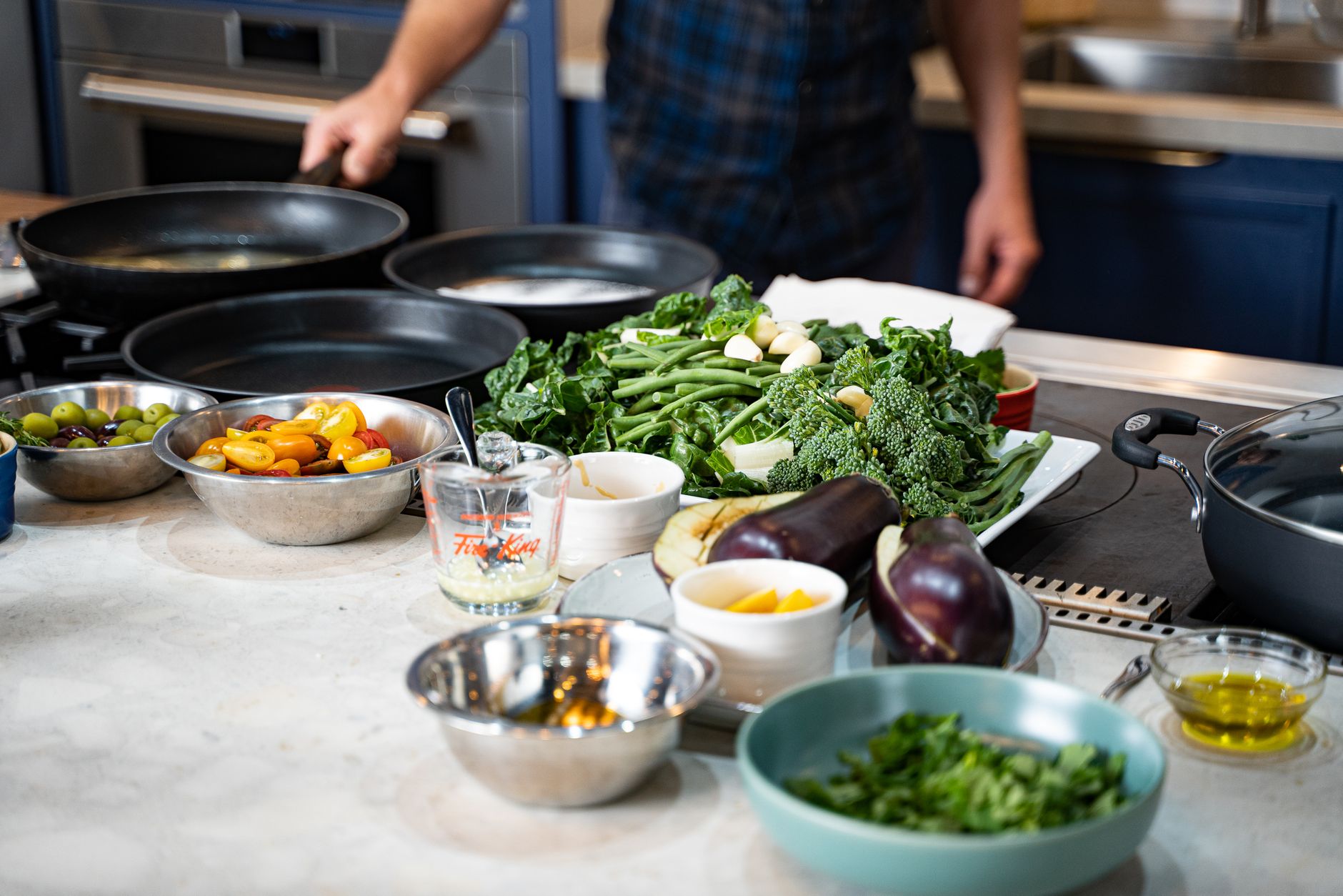 Fresh vegetables ready for cooking in a modern kitchen setting with natural light.